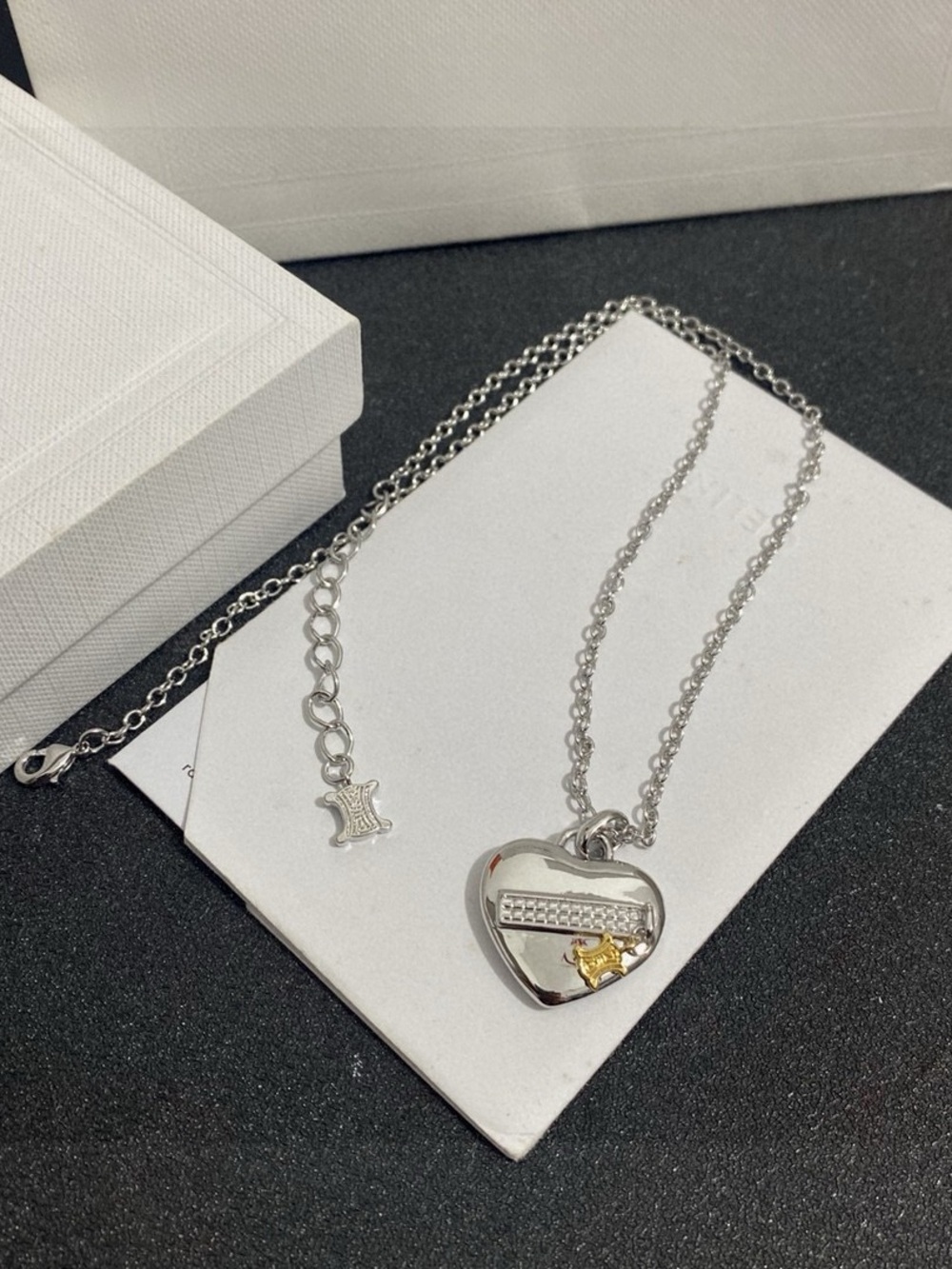 Celine Silver Heart Necklace with Gold Star Accent
